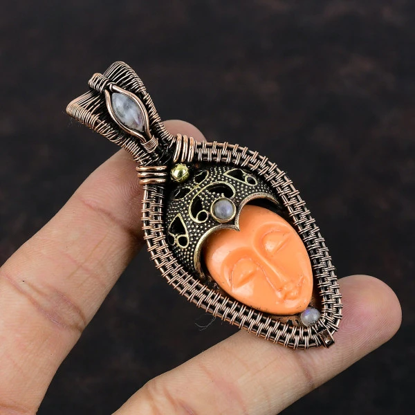 Orange Carved Bone Face Oval Orange Handmade Copper Wire Wrapped Pendant