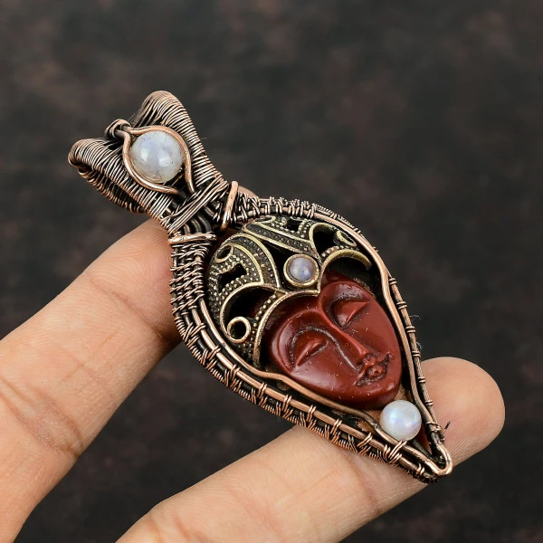 Red Carved Bone Face Oval Red Handmade Copper Wire Wrapped Pendant