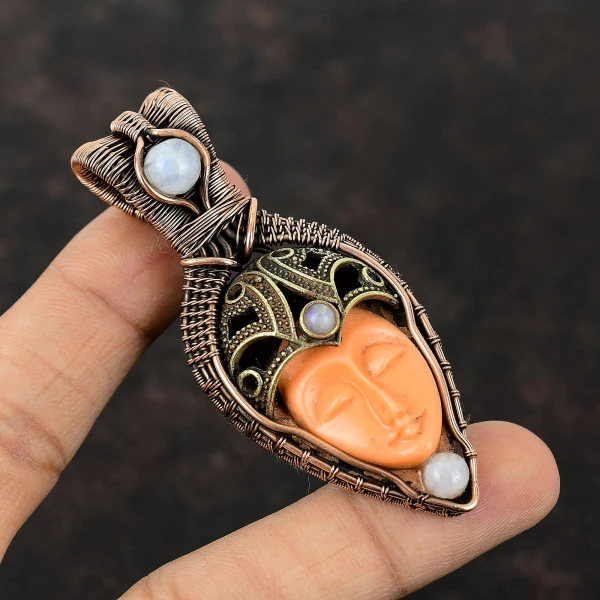 Orange Carved Bone Face Oval Orange Handmade Copper Wire Wrapped Pendant