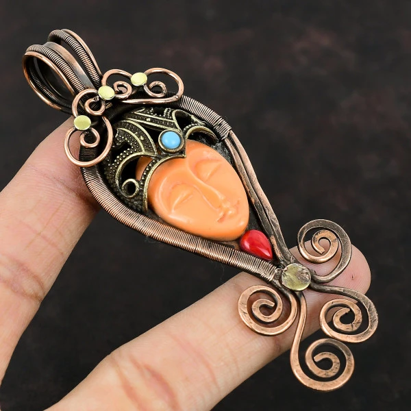 Orange Carved Bone Face Oval Orange Handmade Copper Wire Wrapped Pendant